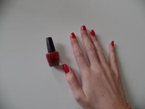 OPI - the leading market brand shows a solid red in one coat, strong enough to be compared easily to Louboutin Rouge (below).